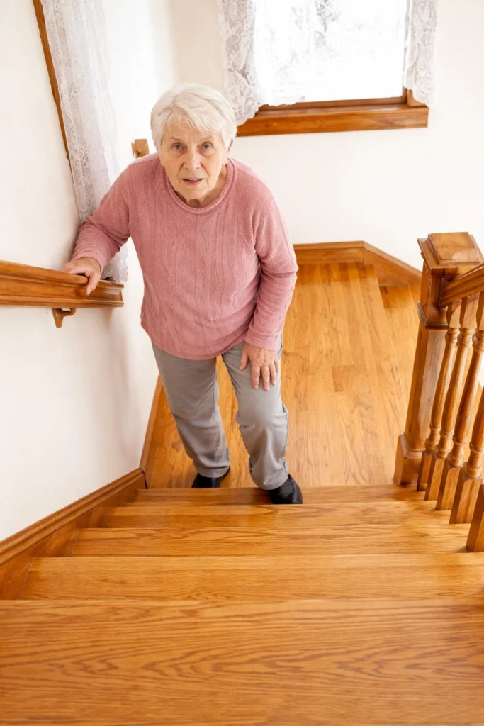 senior at the bottom of stairs